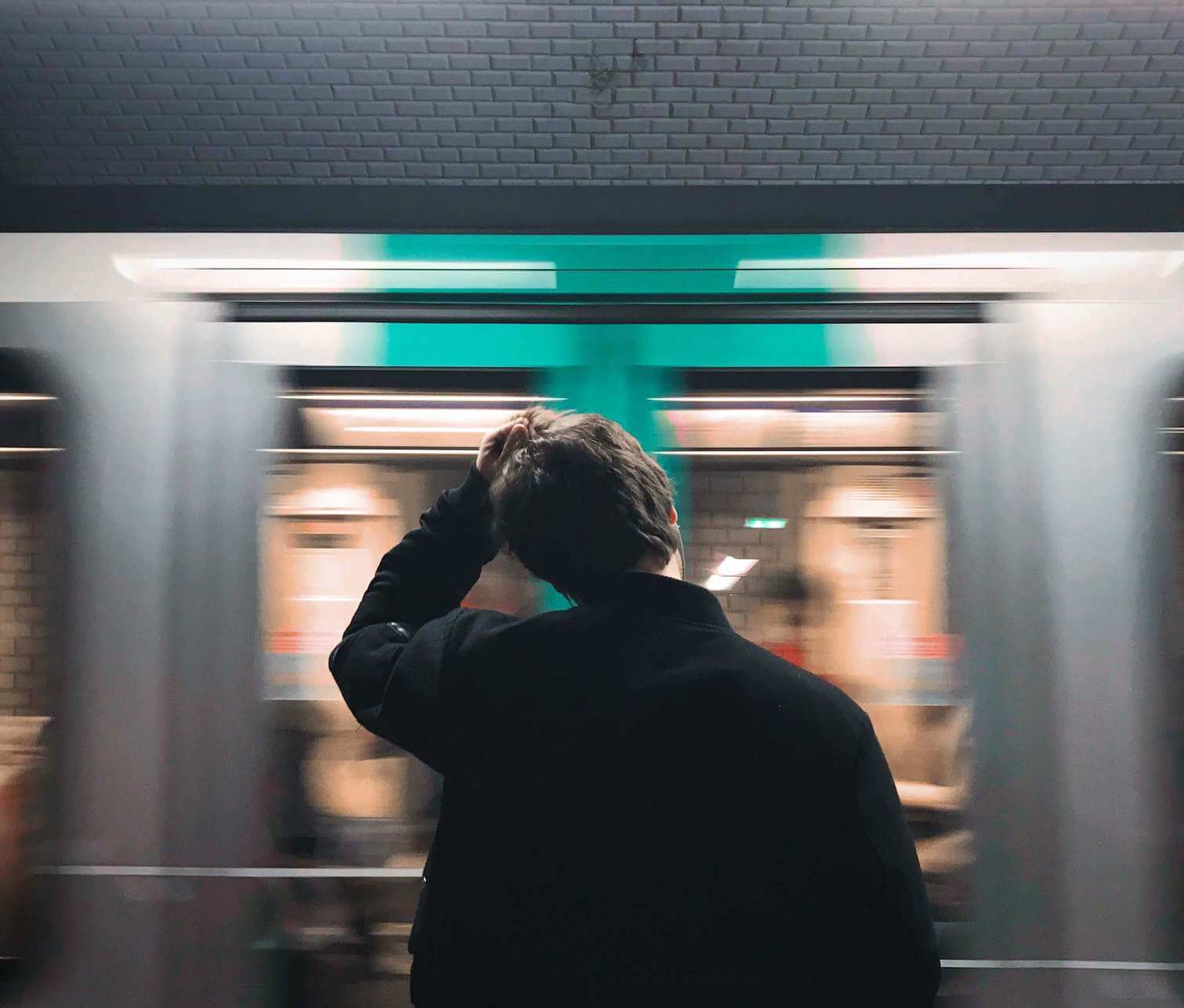 Man tensed in front of train